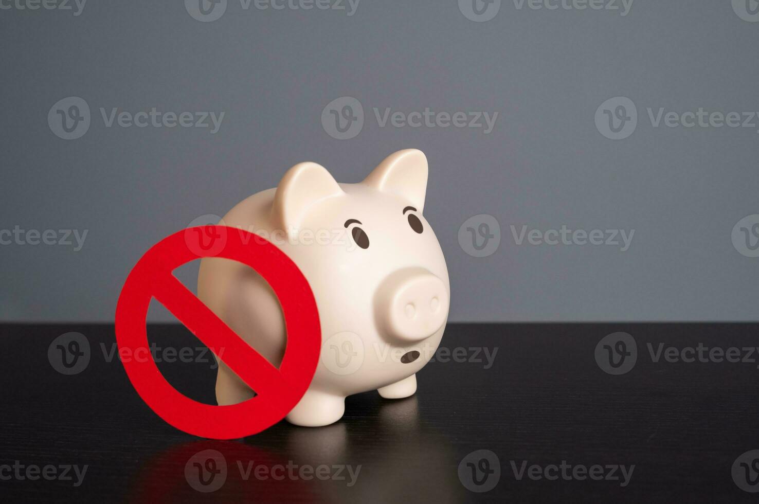 The piggy bank is concerned about sanctions and savings freezes. Capital outflow restrictions. Lack of funds. Confiscation. Policy of not holding savings in cash. Bankruptcy and deposit risk. photo