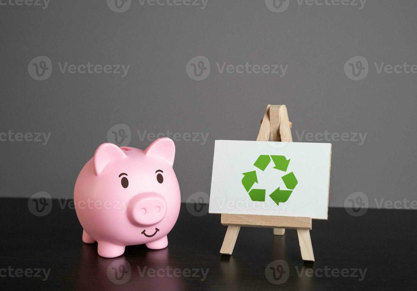 Pig piggy bank and recycling sign. Generate profit. Conserve natural resources, reduce waste, create jobs in recycling industry. Creating revenue streams through sale of recycled materials. photo