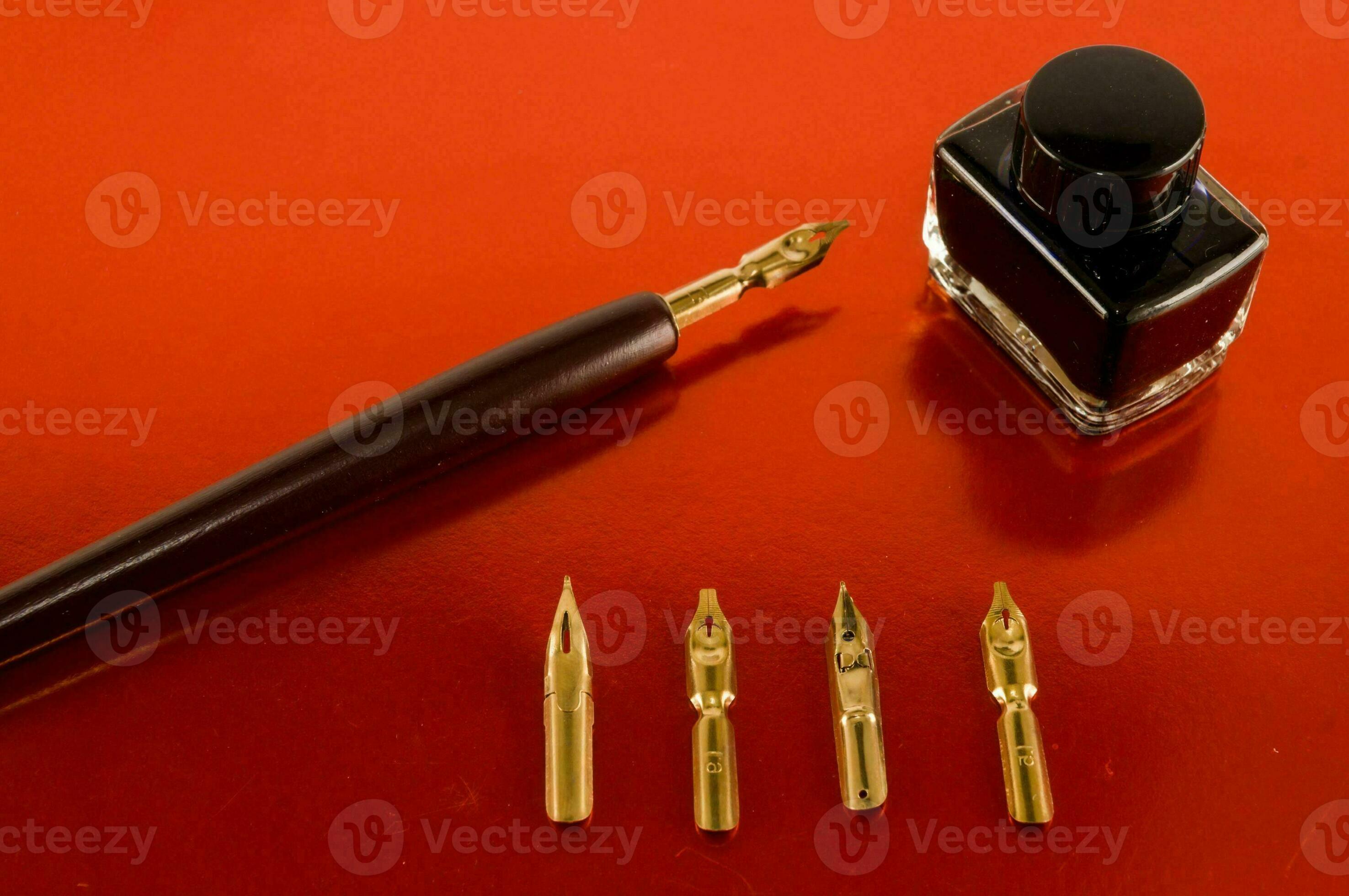 a fountain pen, ink and a bottle of ink 34548899 Stock Photo at Vecteezy