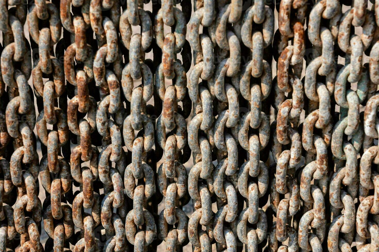 a close up of a chain link wall photo