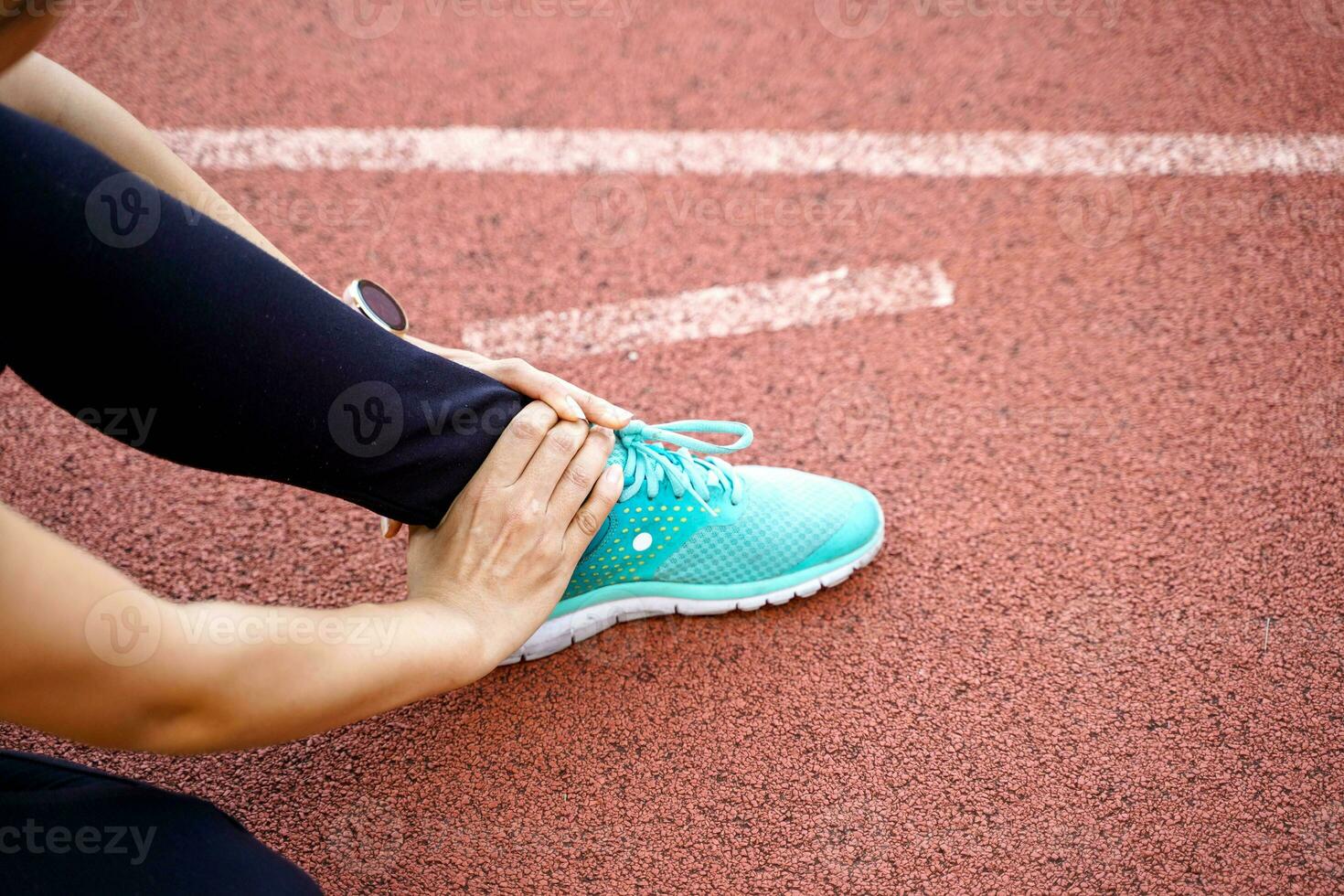 Closeup and crop hands of human holding ankle after the injury accident from workout. photo