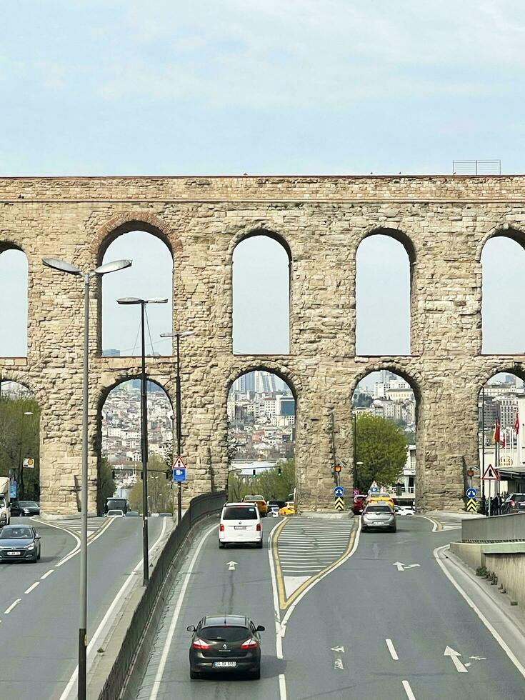 15 of April 2023 - Istanbul, Turkey - The Valens Aqueduct is part of the water supply system of Constantinople. Located in the old part of Istanbul on Ataturk Boulevard. photo