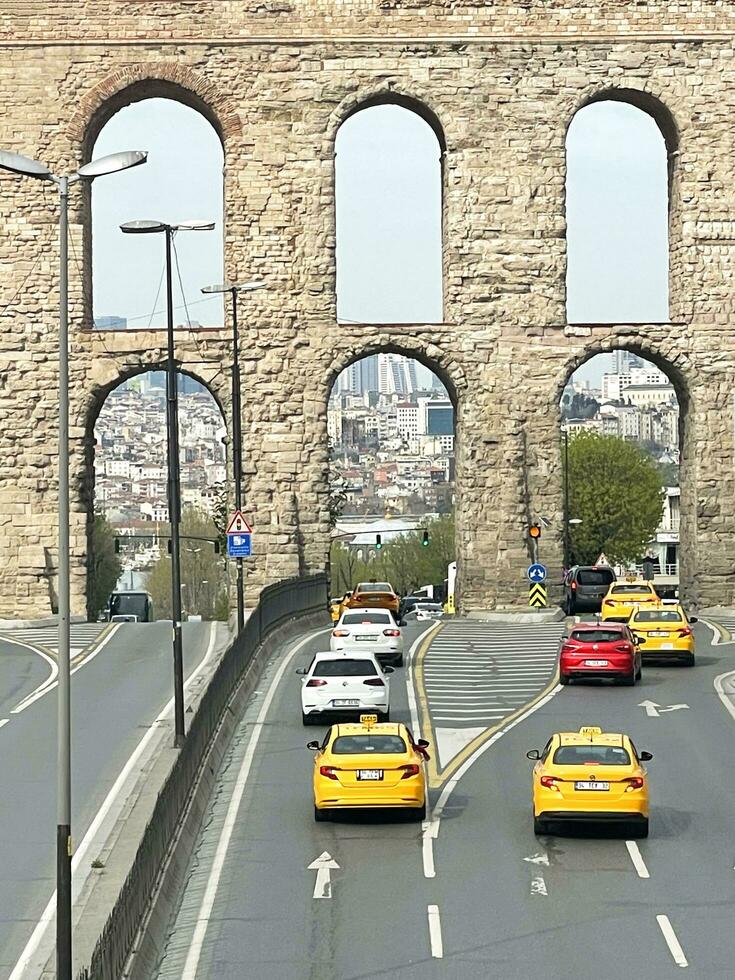 15 of April 2023 - Istanbul, Turkey - The Valens Aqueduct is part of the water supply system of Constantinople. Located in the old part of Istanbul on Ataturk Boulevard. photo