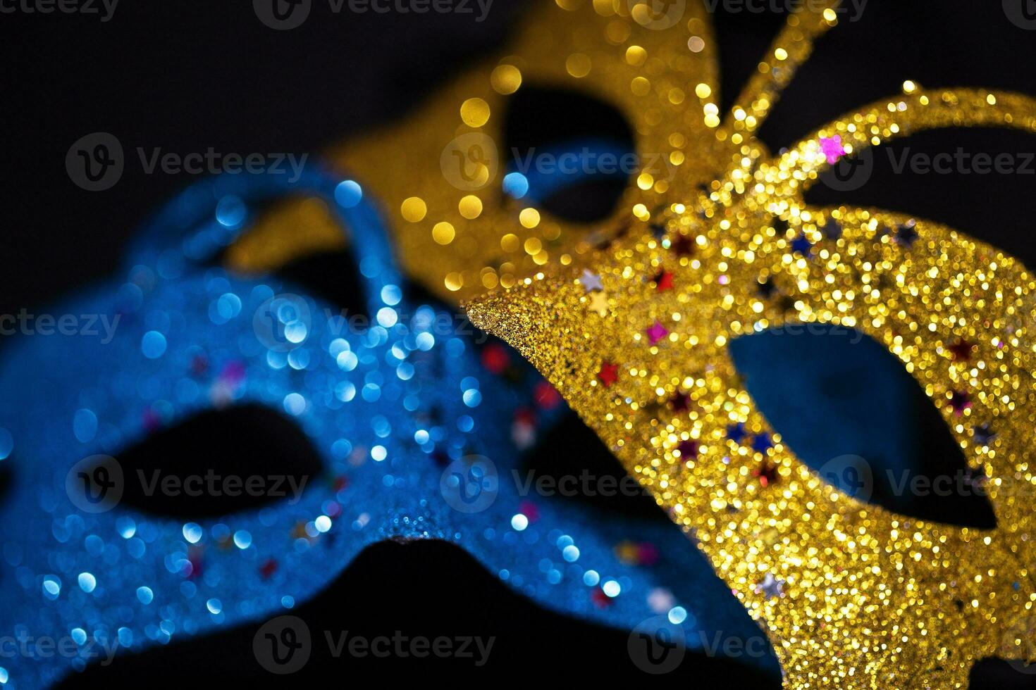 Luxurious Venetian shiny masks on a dark background. Carnival masquerade fantasy mask. Holiday and party concept. Blurred photo. photo