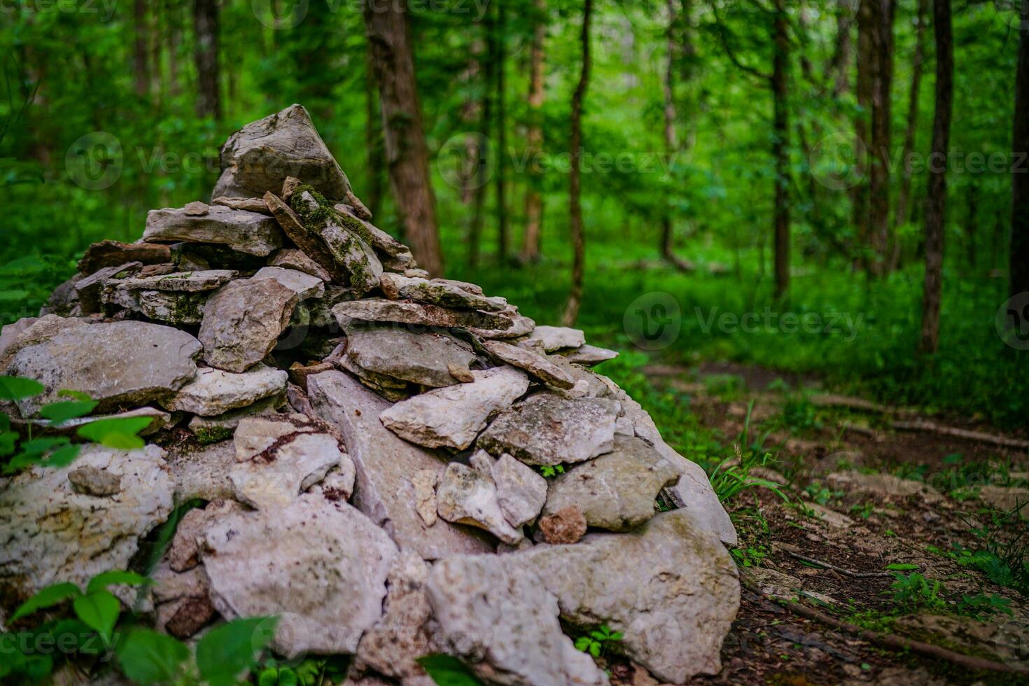 Human Made Artifact, Stack of Rocks deep in the Forest photo