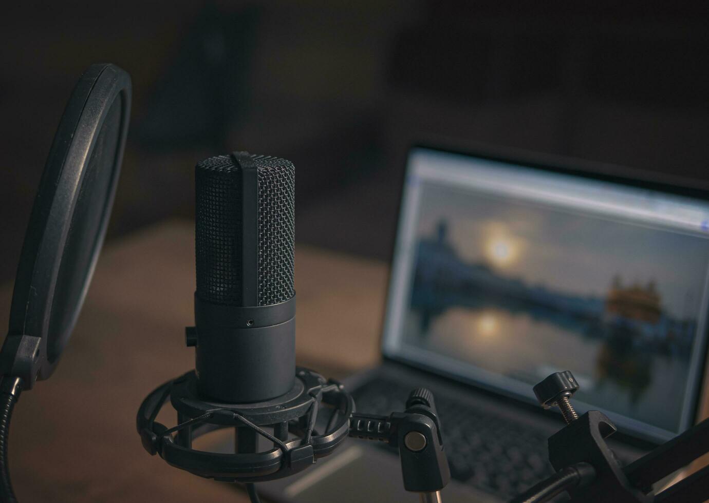 Home studio for podcasts. Large Microphone, notebook and notebooks on the table. Close-up. Cinematic style photo