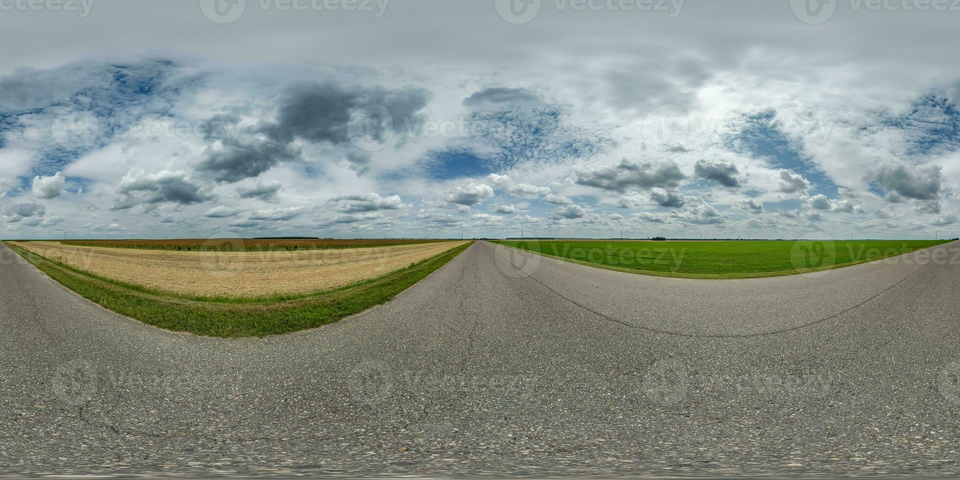 spherical 360 hdri panorama on old asphalt road among fields with clouds and sun on blue sky in equirectangular seamless projection, as skydome replacement in drone panoramas, game development photo