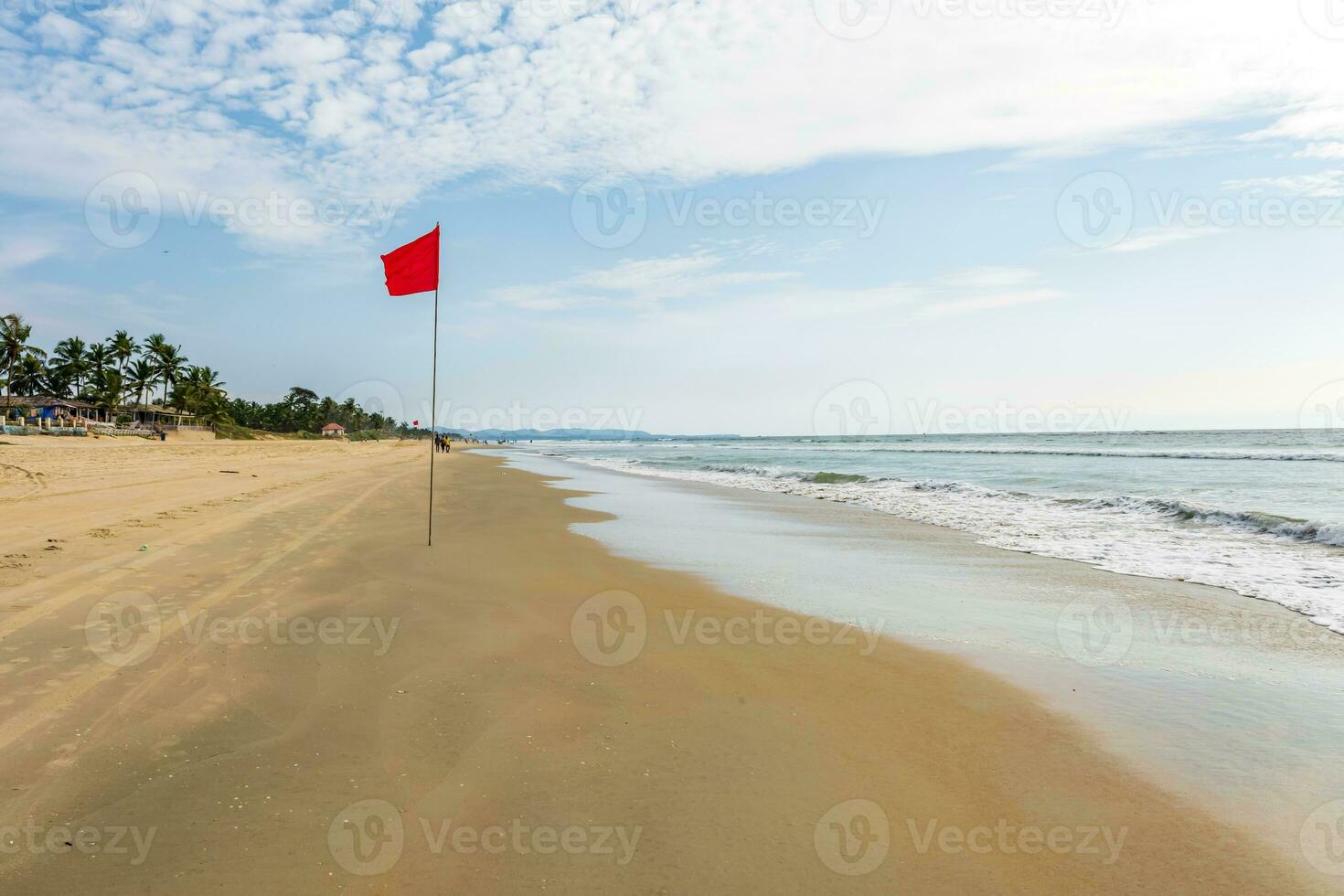 red flag on beach on sea or ocean as a symbol of danger. The sea state is considered dangerous and swimming is prohibited. photo