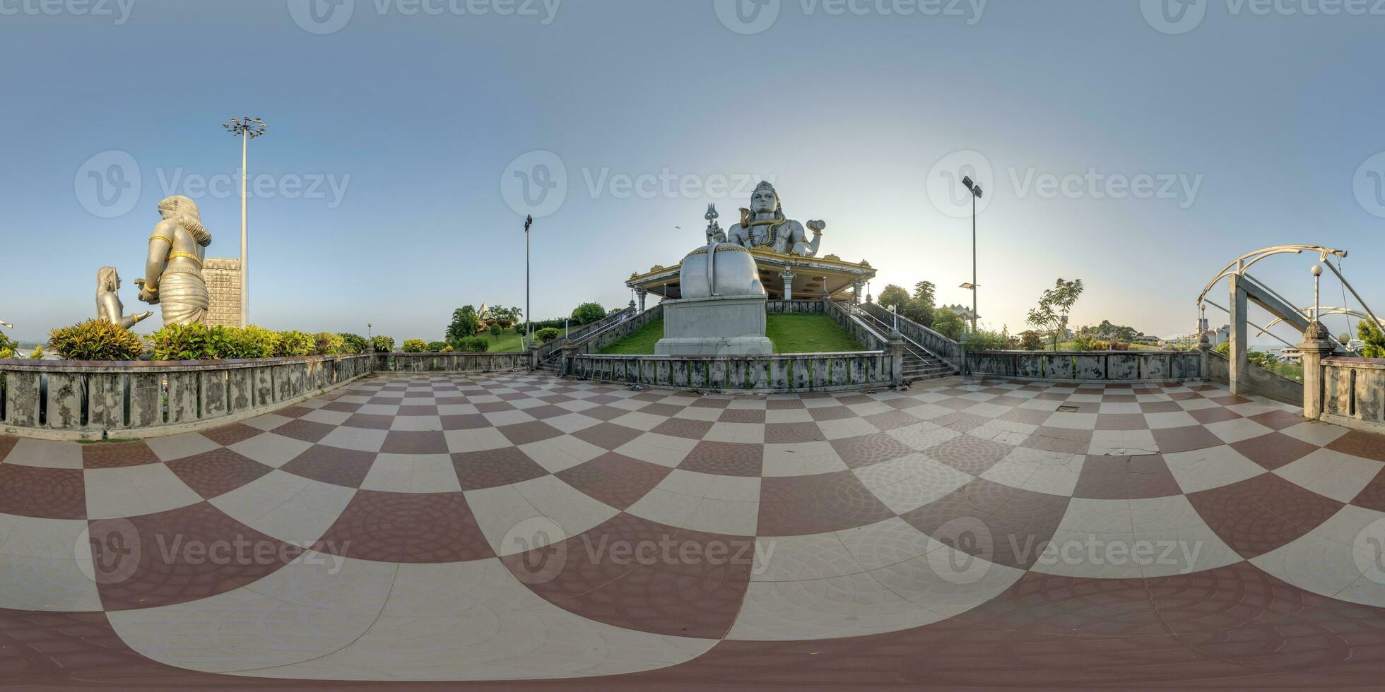 full 360 hdri panorama near tallest hindu shiva statue in india on mountain near ocean in equirectangular projection photo