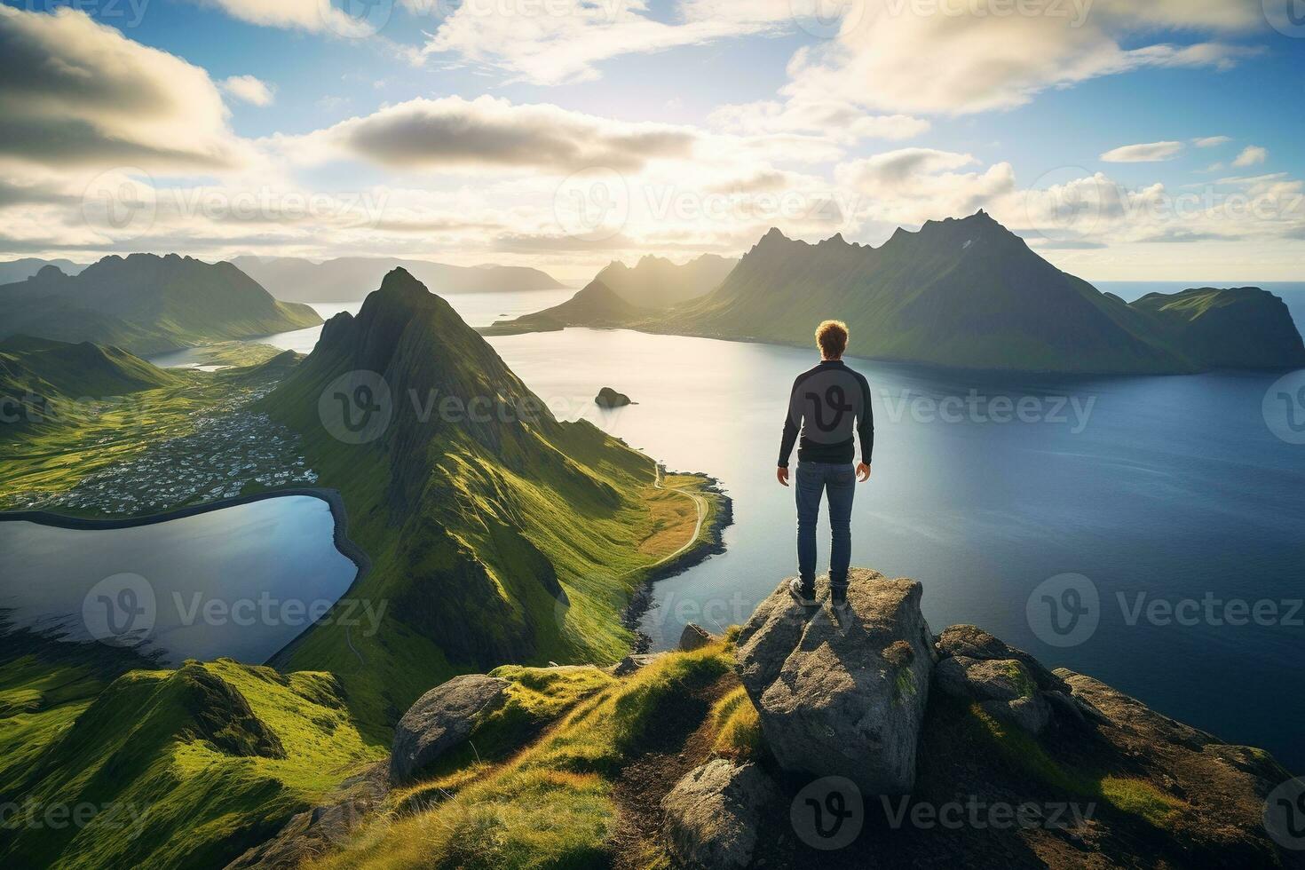Man standing on the top of a mountain and enjoying the view AI generated photo