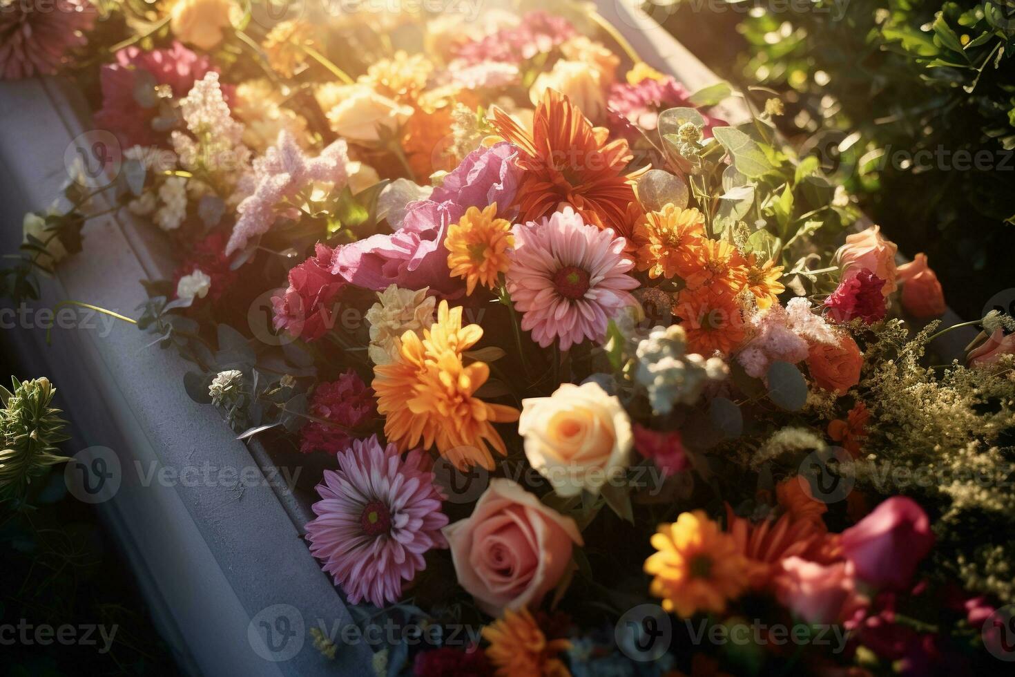 Colorful flowers on the grave in the cemetery, funeral concept. AI generated photo