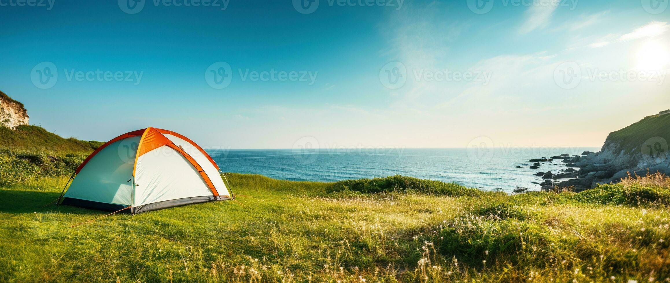 Camping tent and camping equipment on green grass with sea view background AI generated photo