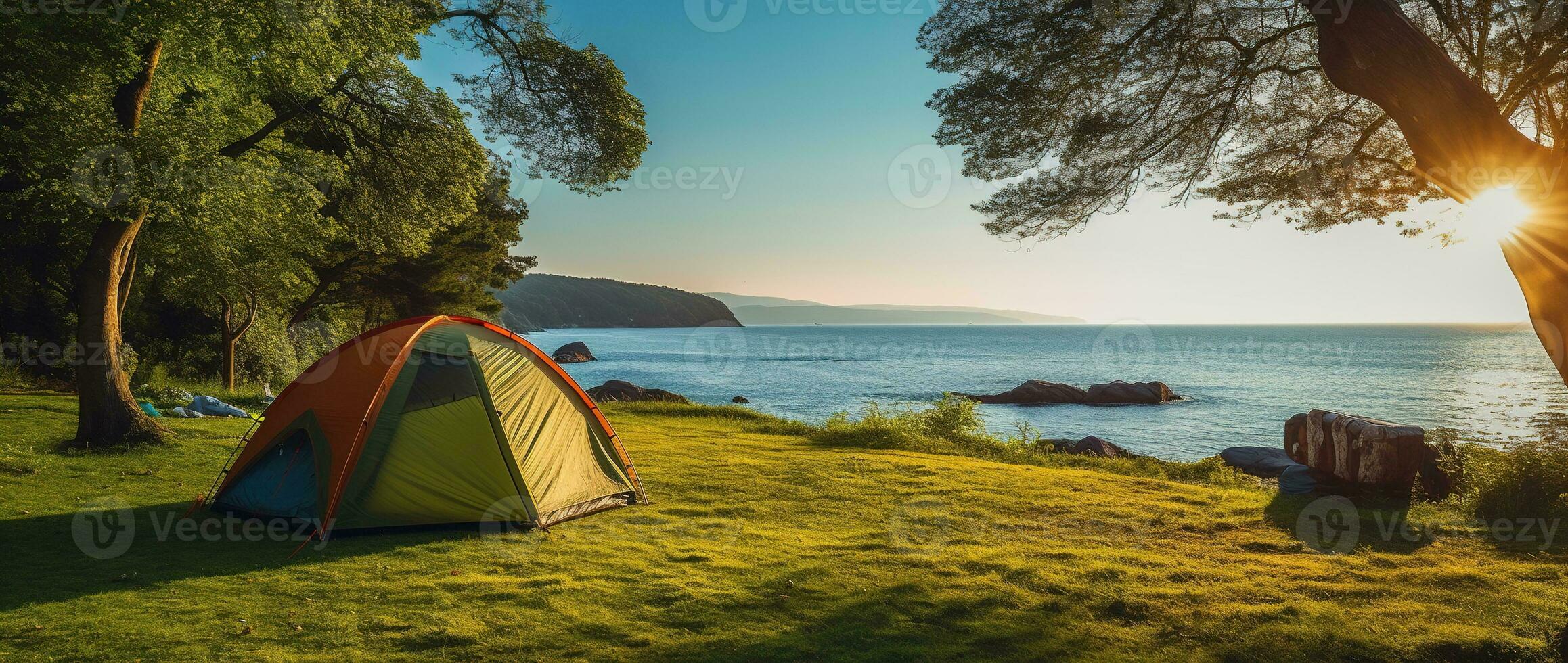 Camping tent and camping equipment on green grass with sea view background AI generated photo
