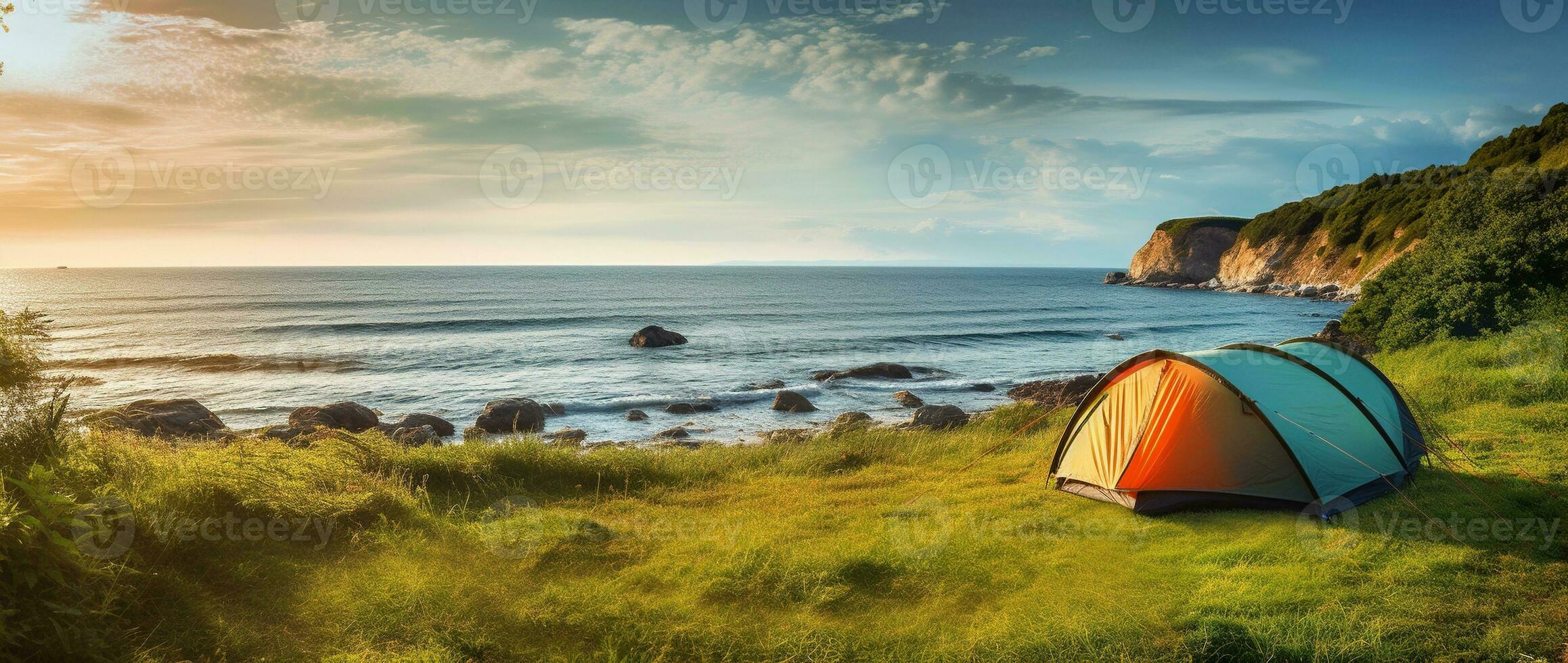 Camping tent and camping equipment on green grass with sea view background AI generated photo