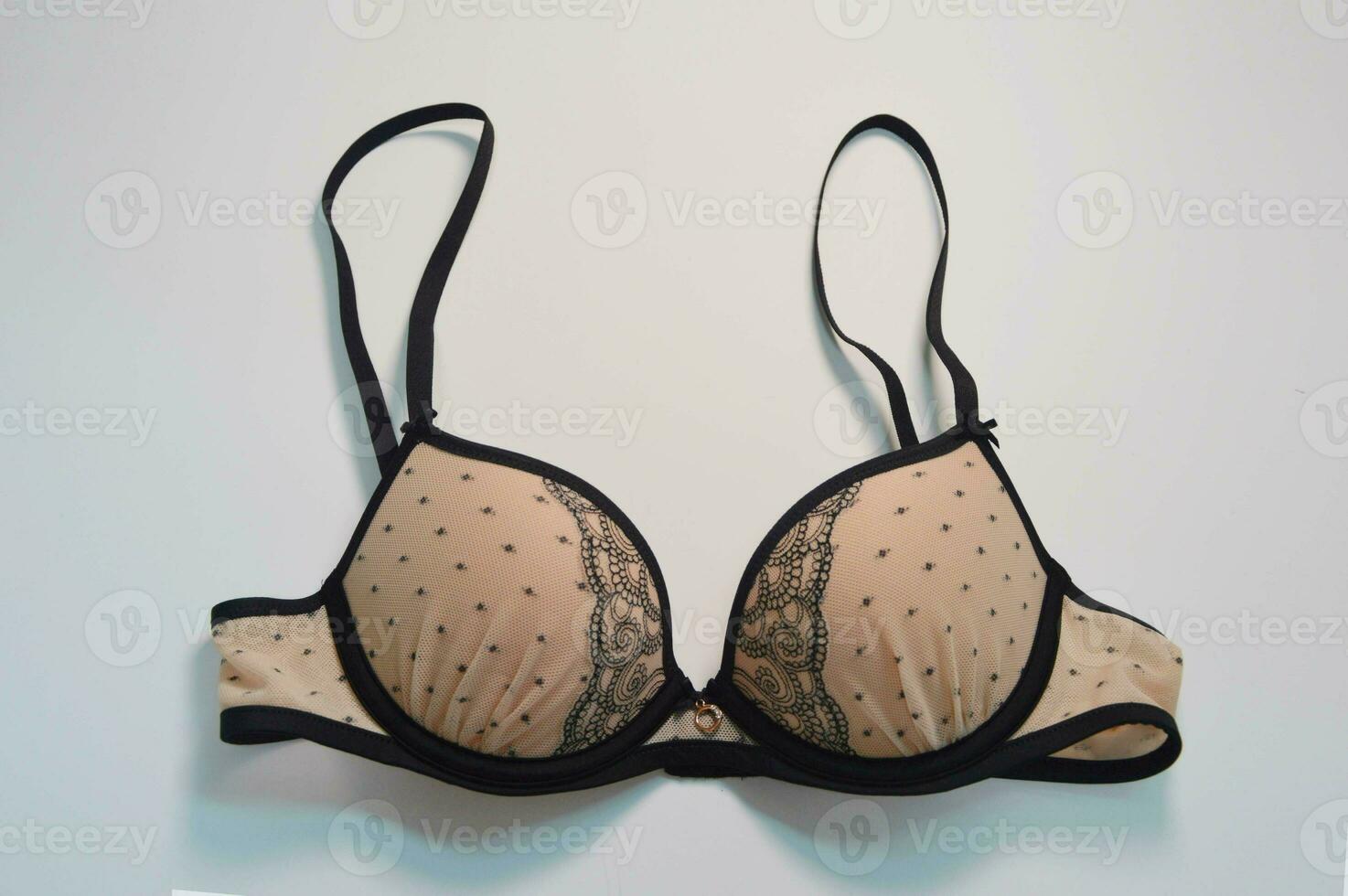 Lingerie. Beige bra with black lace on a white background. Fashionable  beautiful women's underwear. 34596761 Stock Photo at Vecteezy