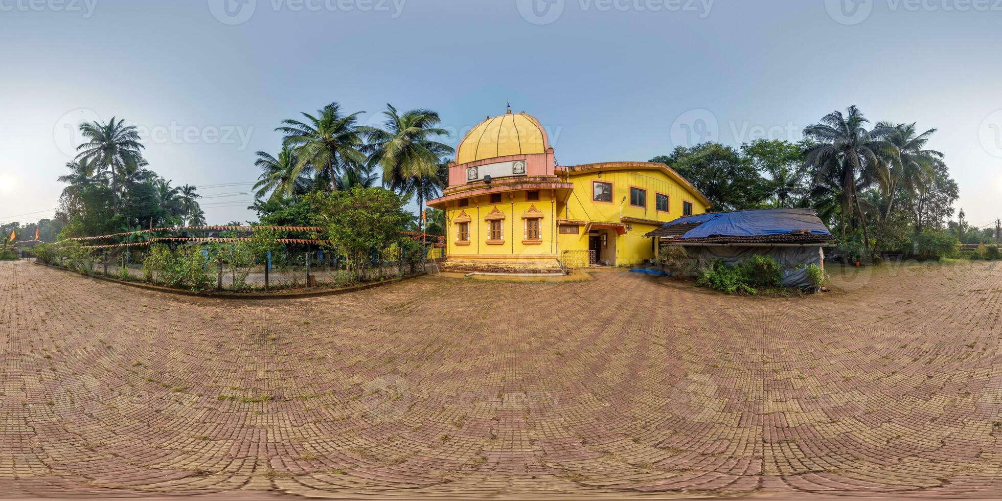 full hdri 360 panorama near hindu temple of goddess laxmi in jungle among palm trees in Indian tropic village in equirectangular projection with zenith and nadir. VR AR content photo