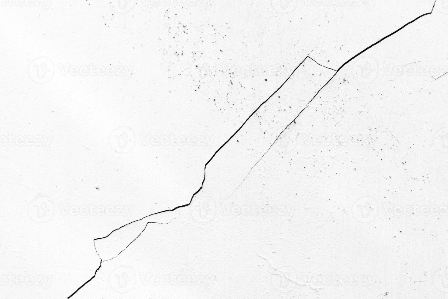 Little crack on white wall texture photo