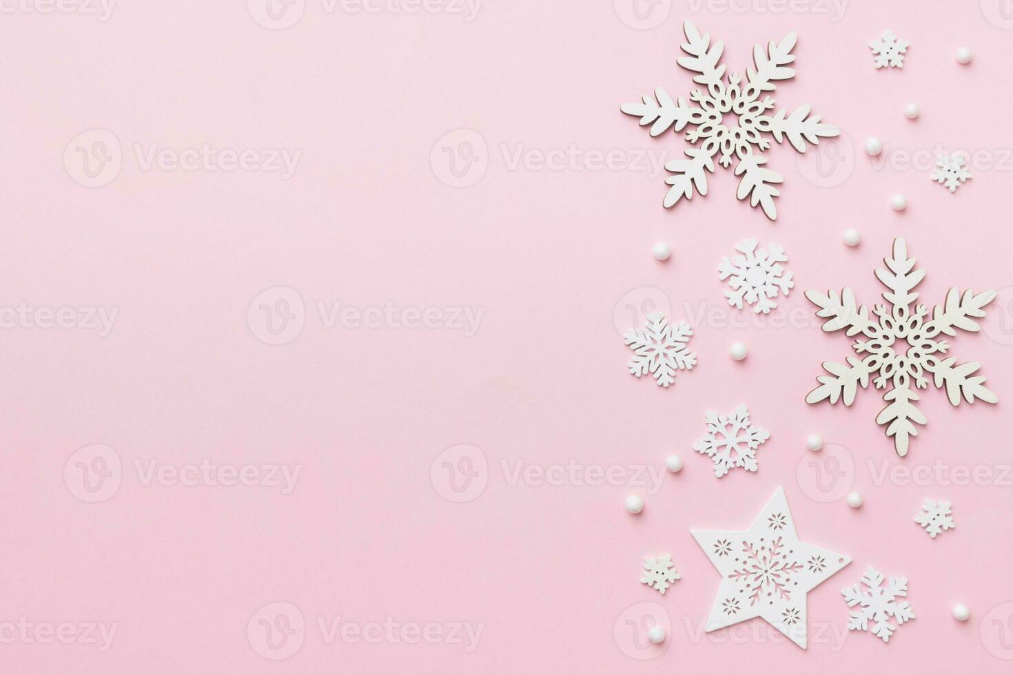New Year composition white christmas snowflakes. Christmas decor background with pine cones. Top view with copy space photo