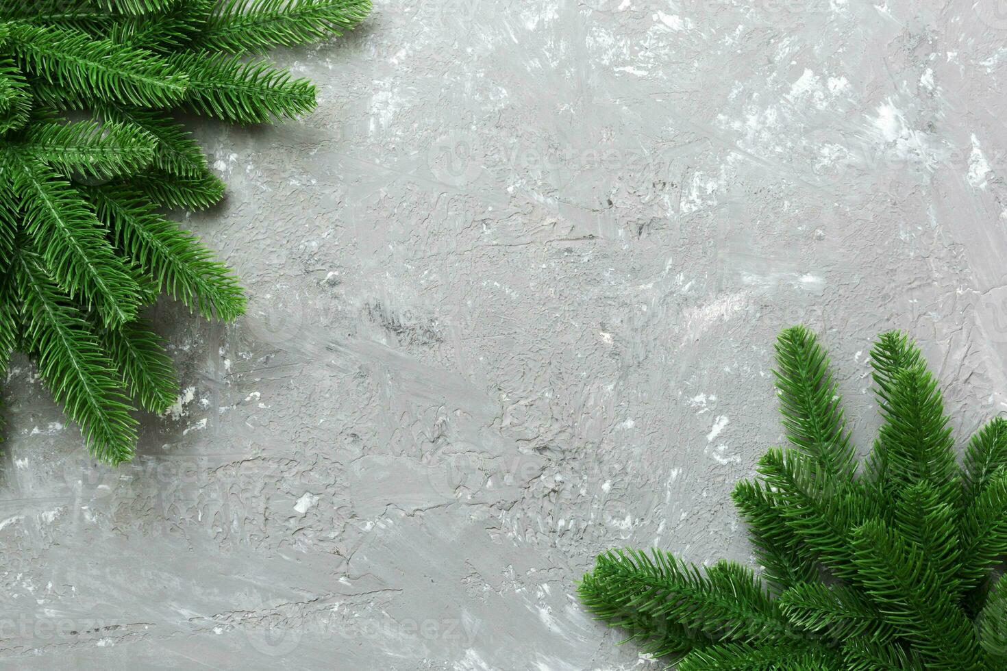 Christmas holiday background with copy space for advertising text. Fir branches on color background . Flat lay, top view photo