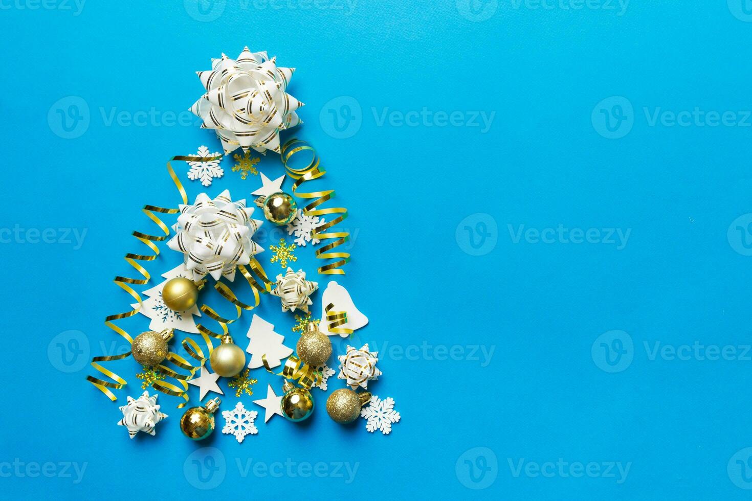 Christmas tree made from colored ball decoration on colored background, view from above. New Year minimal concept with copy space photo