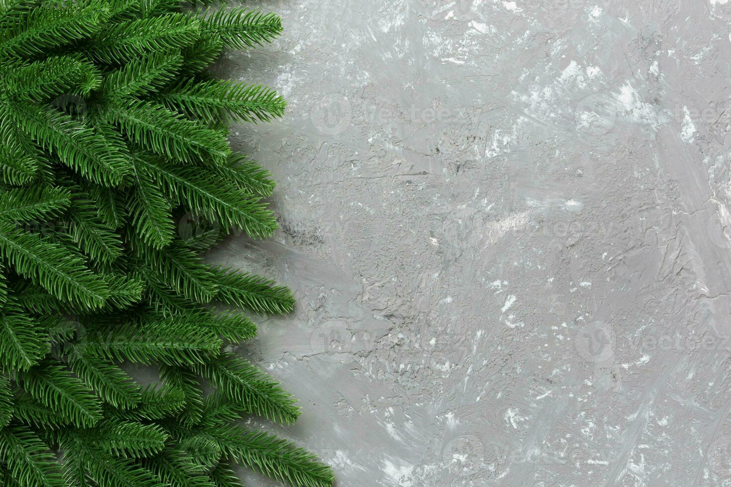 Christmas holiday background with copy space for advertising text. Fir branches on color background . Flat lay, top view photo