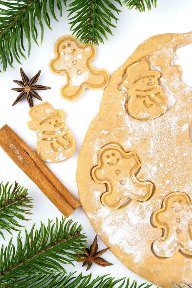 Christmas cookies in the shape of a snowman and gingerbread man. Top view. photo
