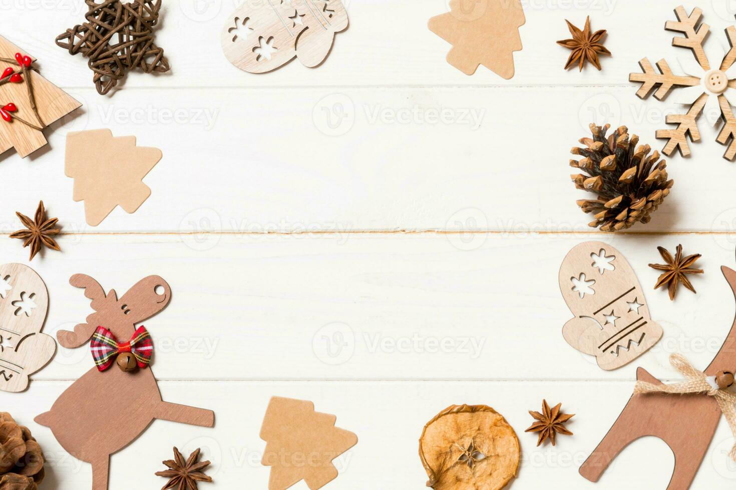 Top view of Christmas decorations and toys on wooden background. Copy space. Empty place for your design. New Year concept photo