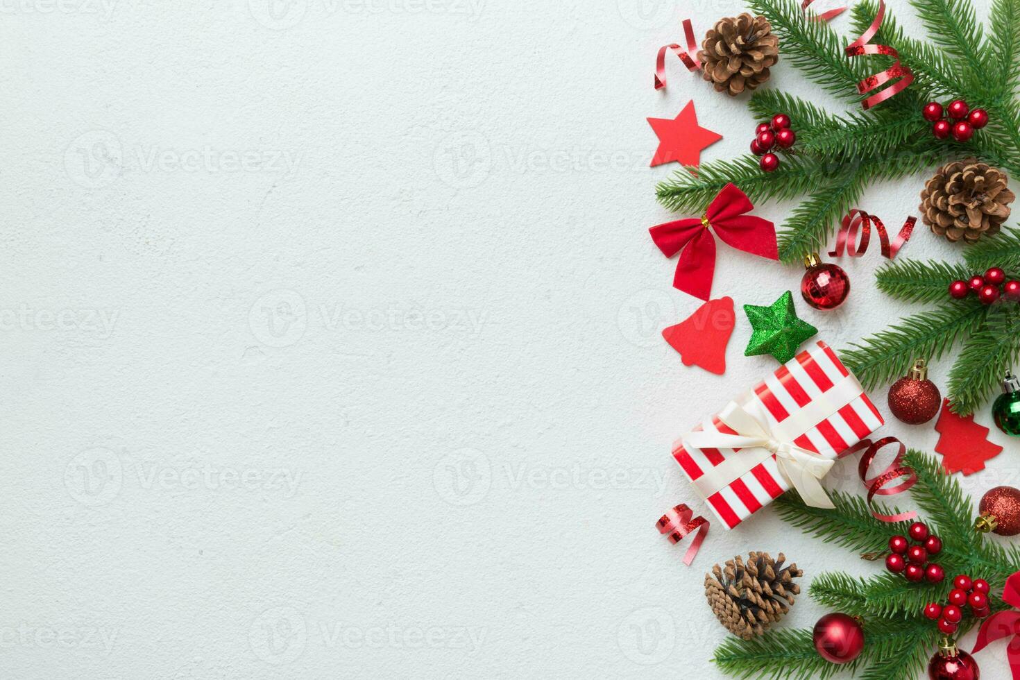 Christmas decorations and fir tree branch and gift boxon dark table. Top view frame with copy space photo