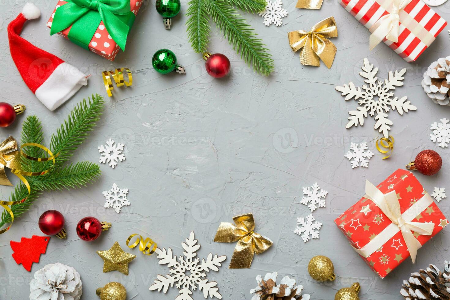 Christmas decorations and fir tree branch and gift boxon dark table. Top view frame with copy space photo