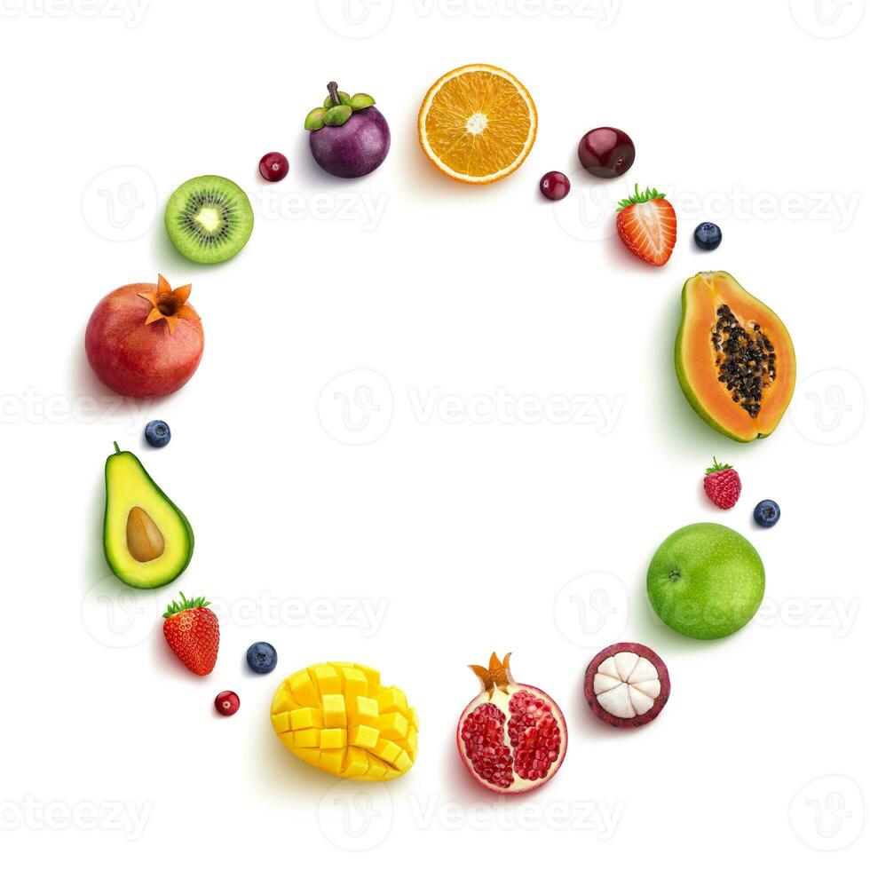 Various fruits and berries isolated on white background, top view, round frame of fruits photo