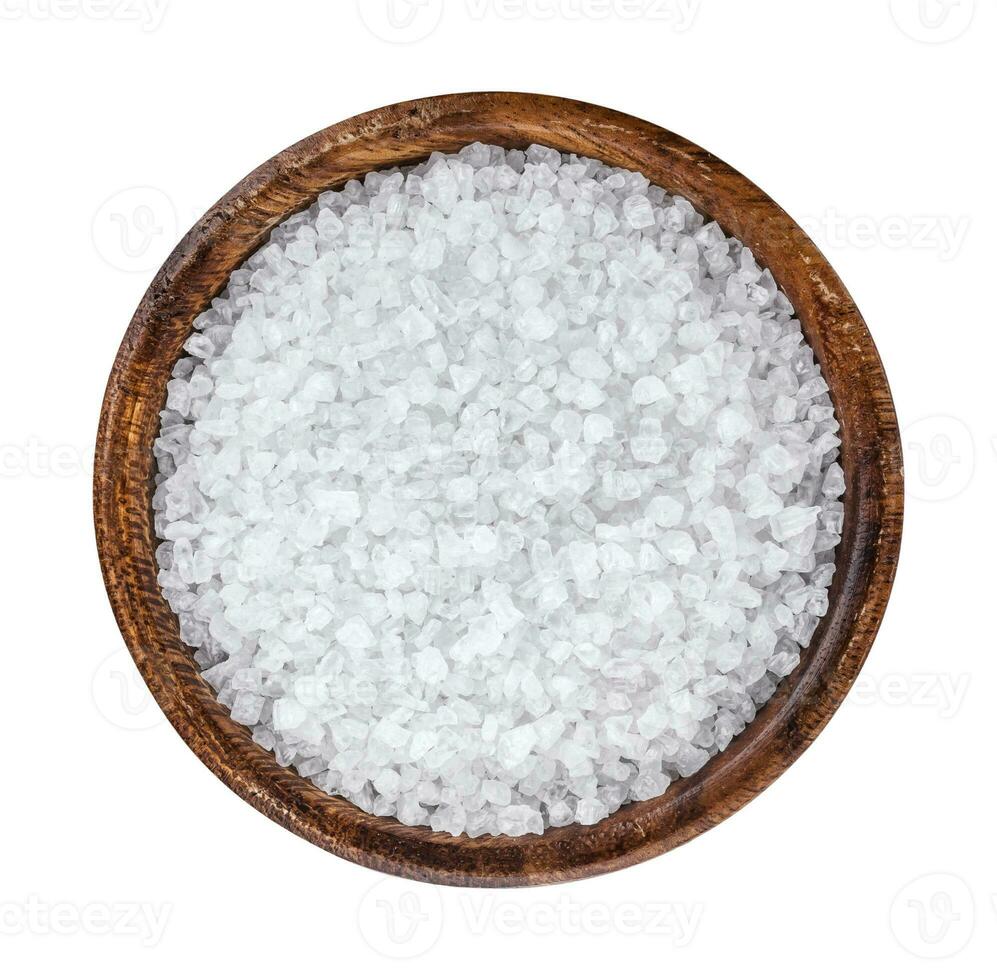 Sea salt in wooden bowl top view photo