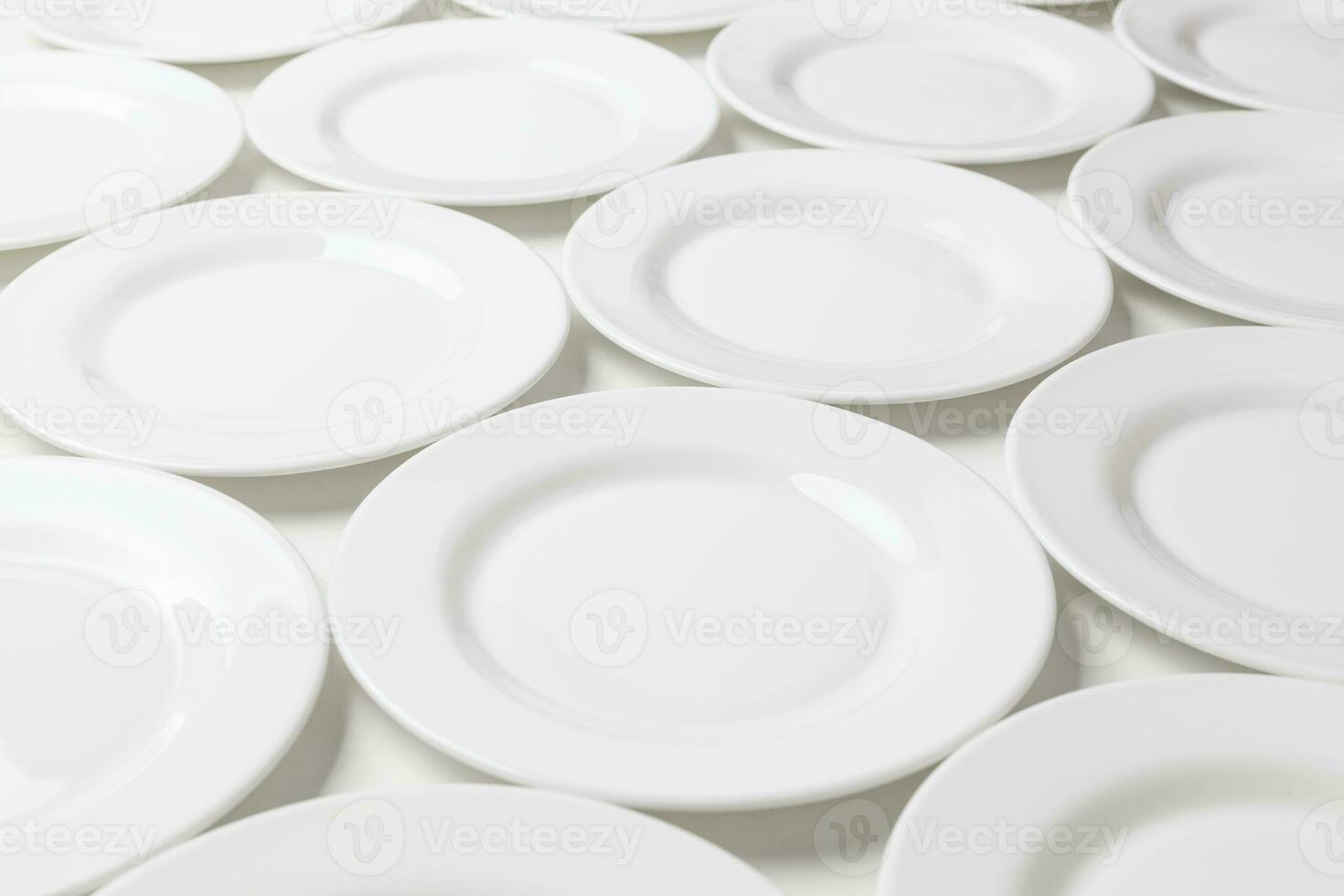 White round plates isolated on white background photo