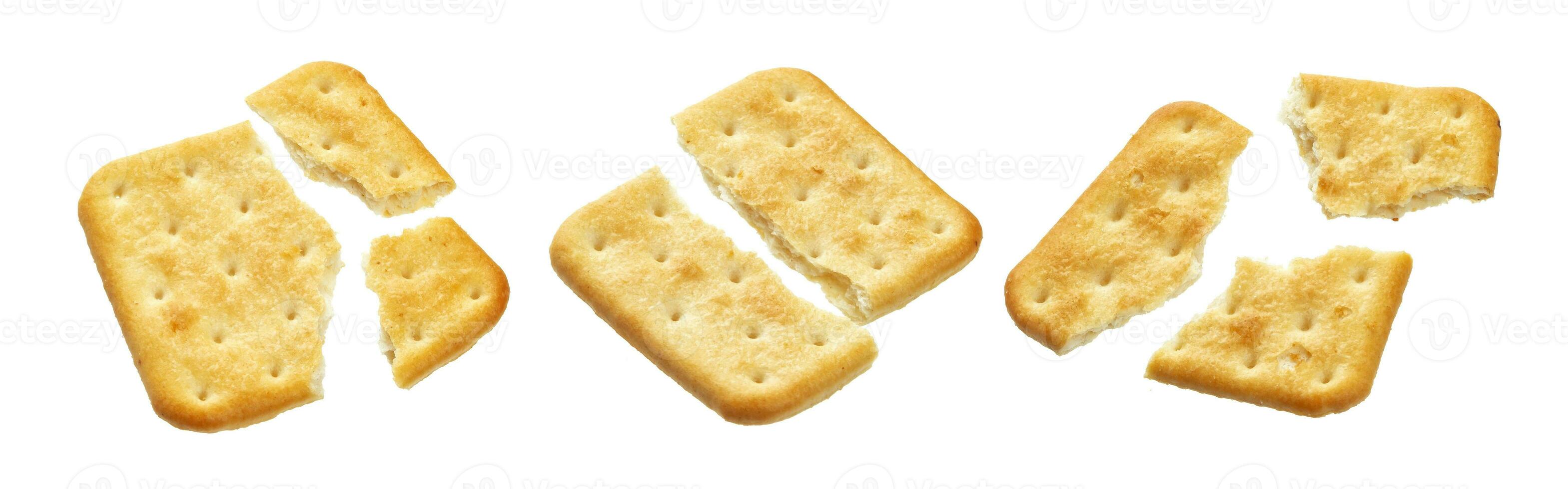 Broken cracker isolated on white background photo