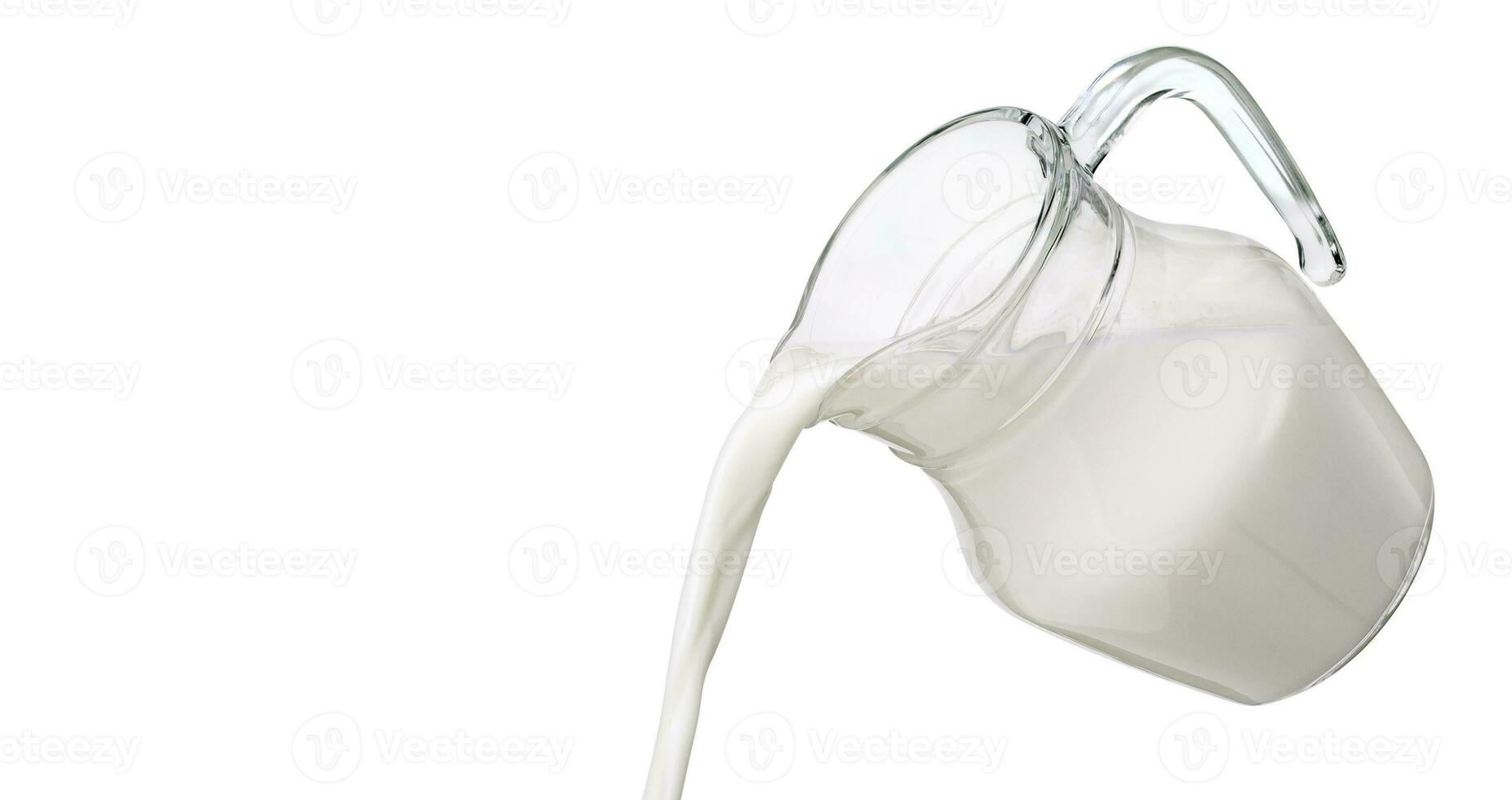 Pouring milk isolated on white background with clipping path photo