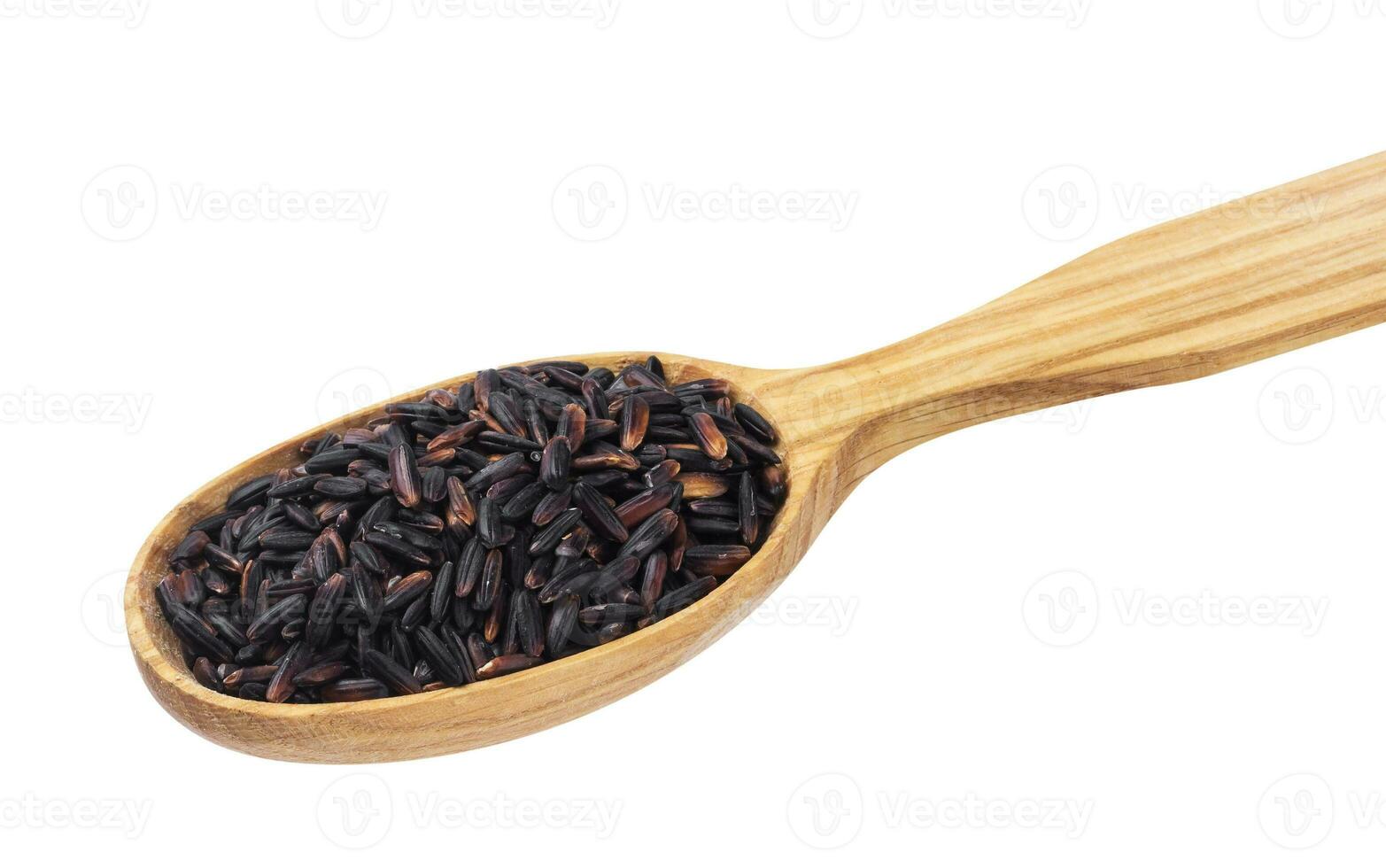 Black rice in spoon on white background photo