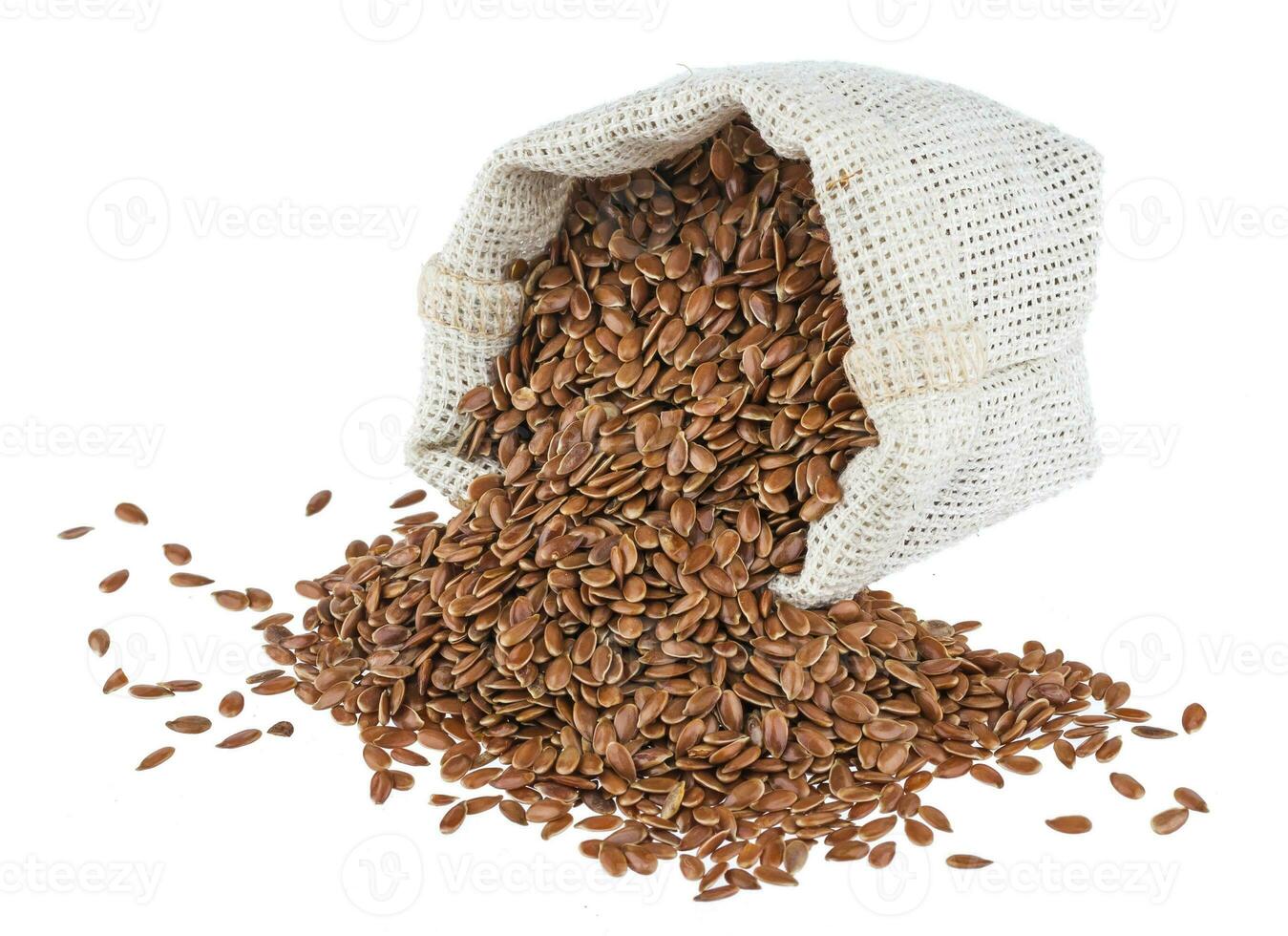Flax seeds in burlap bag isolated on white background photo