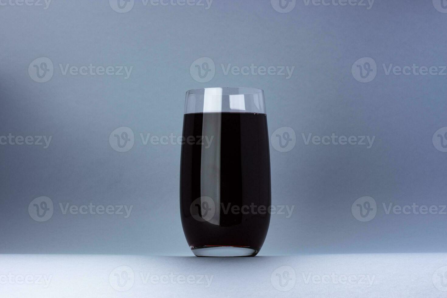 Glass of cherry juice isolated on white background with copy space photo