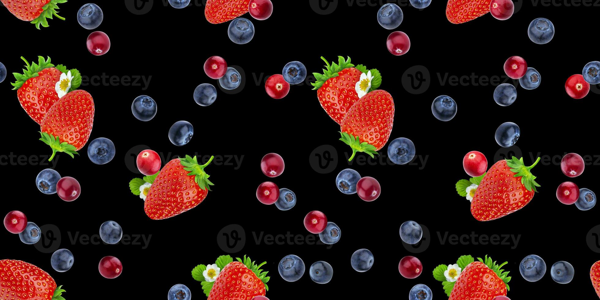 Seamless pattern of flying berries isolated on black background photo