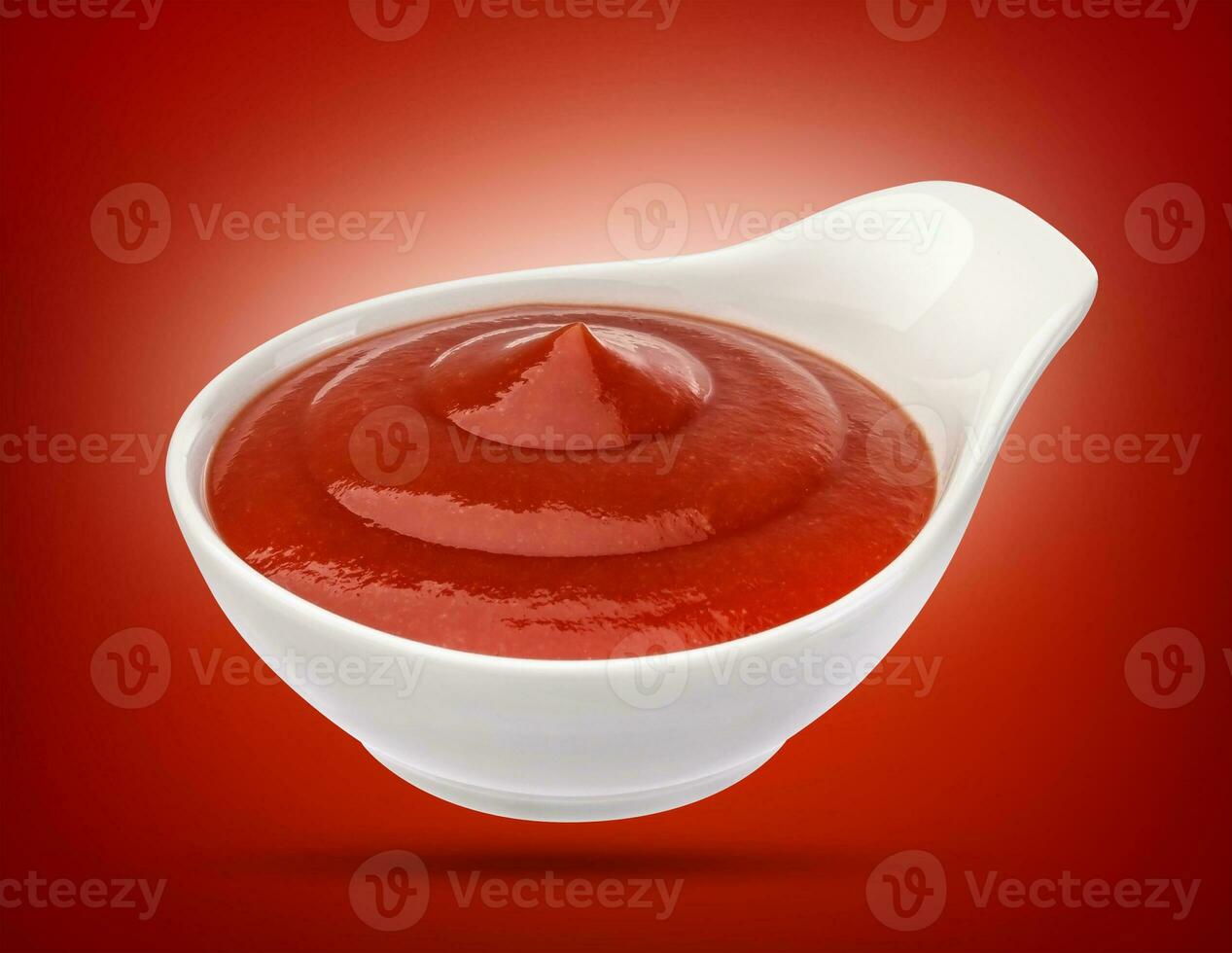 Ketchup in white bowl isolated. Tomato sauce. photo