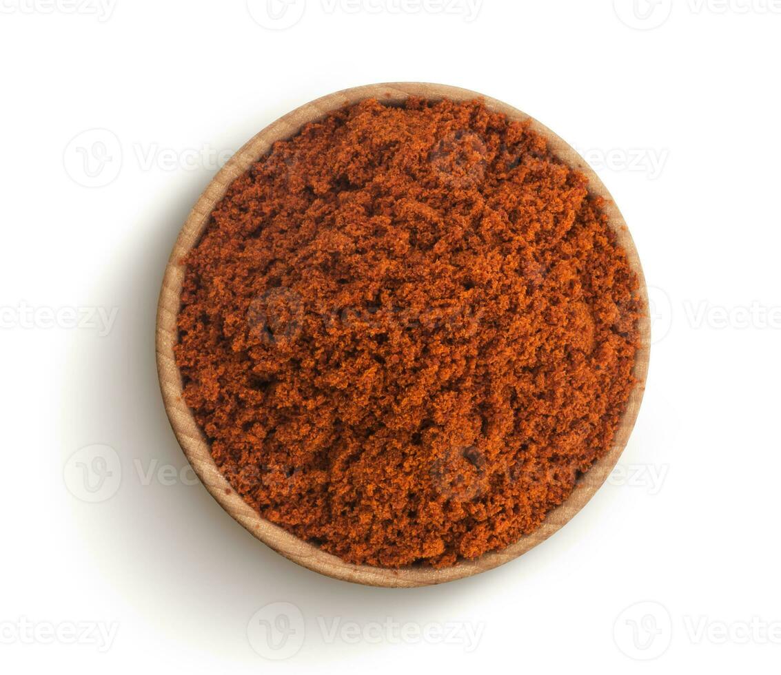 Red paprika powder isolated on white background. Top view photo