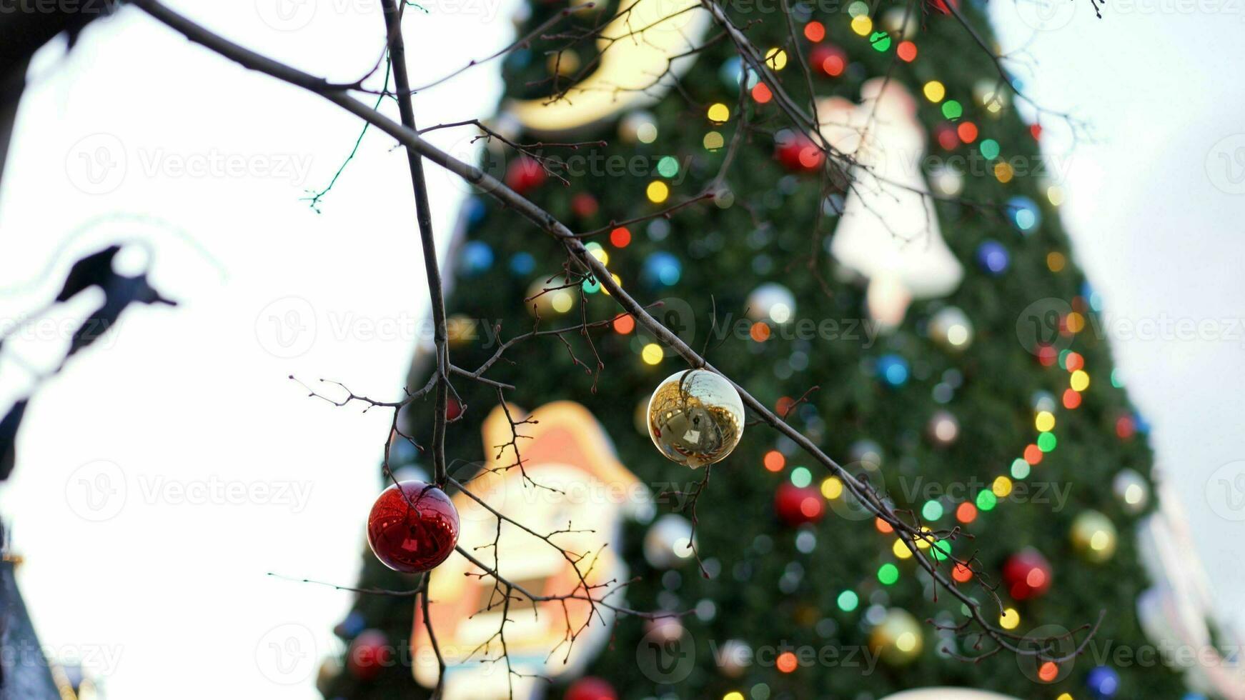 Christmas decor on the street against the background of an elegant Christmas tree. Street Christmas decorations. photo