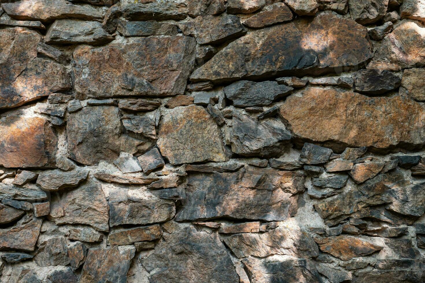 Stone wall. Outdoor background natural stone photo