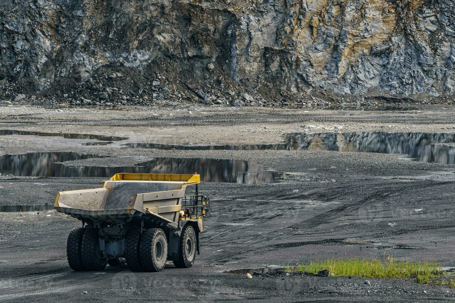 Dump truck in limestone mining, heavy machinery. Mining in the quarry. photo