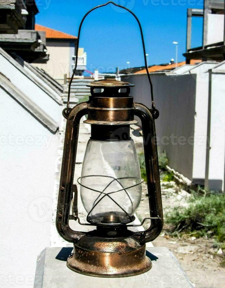 an old fashioned lantern on a roof photo