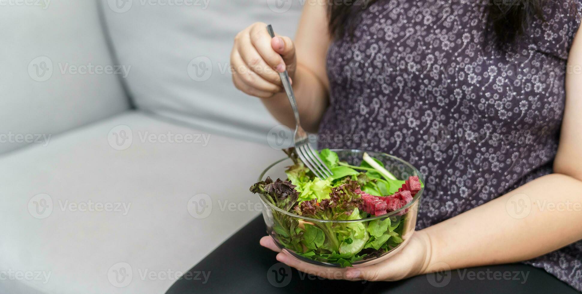 Asian Overweight woman dieting Weight loss eating fresh fresh homemade salad healthy eating concept Obese Woman with weight diet lifestyle. photo