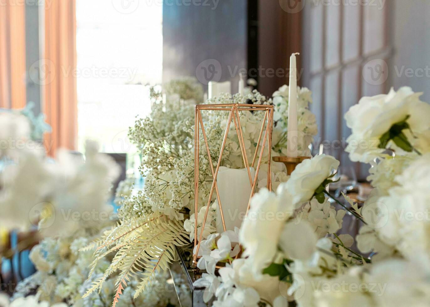 Festive decor.Flowers, gold decor, candles. Side view bokeh background photo