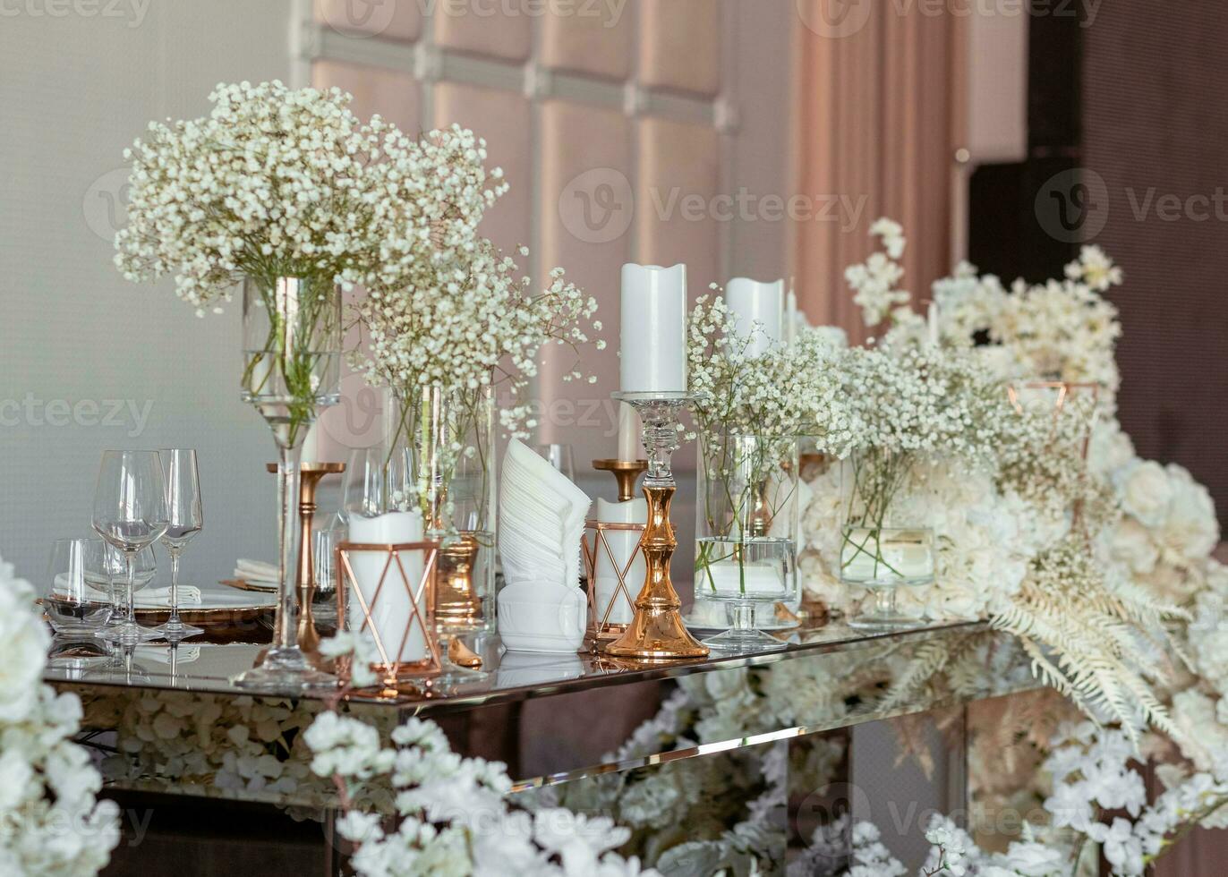 Close view table with floral decor. Modern decor in expensive tones photo