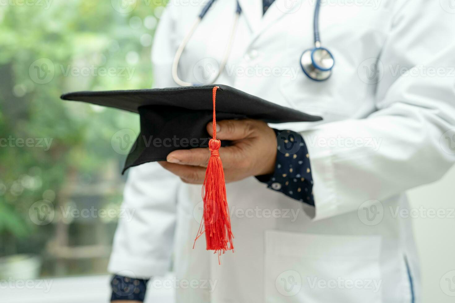 Asian doctor study learn with graduation gap hat in hospital ward, clever bright genius education medicine concept. photo