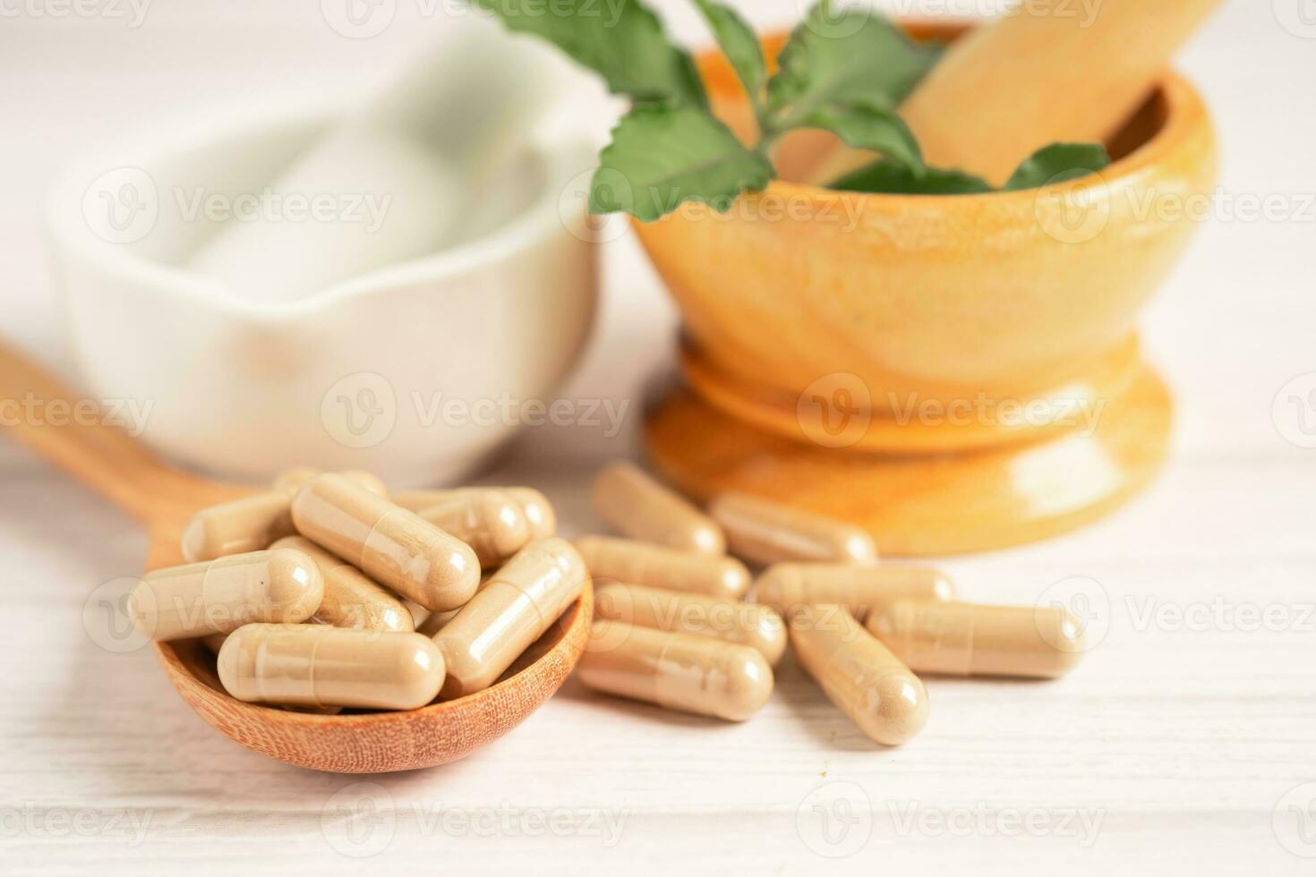 Alternative medicine herbal organic capsule with vitamin E omega 3 fish oil, mineral, drug with herbs leaf natural supplements for healthy good life. photo