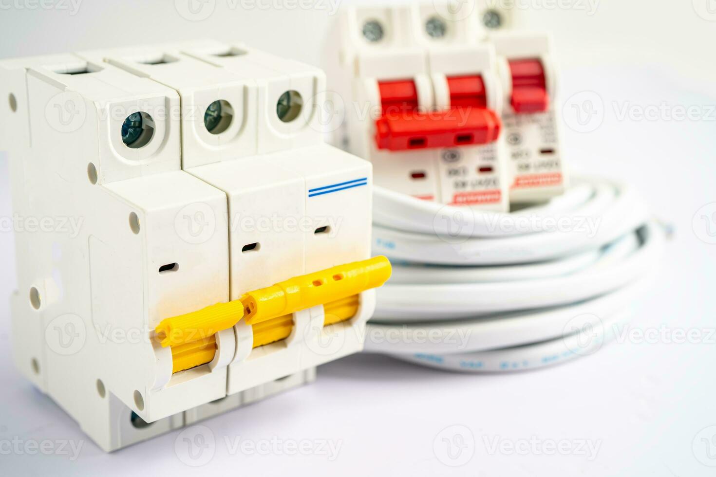 Automatic circuit breaker on white background, control and protect electrical power system. photo